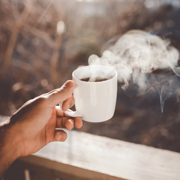 Man holding coffee cup