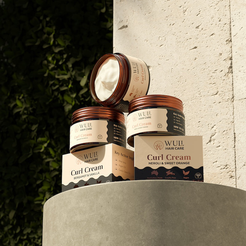 Wuli Hair Care Curl Creams on Plinth with Natural Background